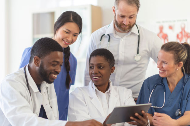 A photo of a group of veterinarians talking and discussing with each other